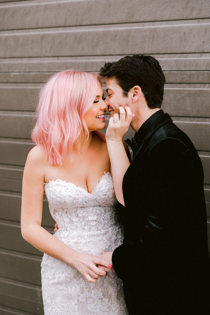 Groom Kissing Bride With Pink Hair Wearing Mermaid Wedding Dress Called Kaysen by Maggie Sottero