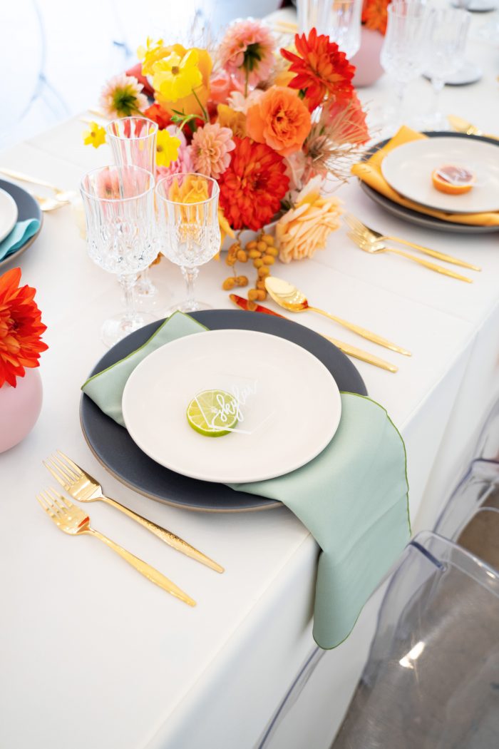 Colorful Table Settings with Turquoise Napkin at Citrus Wedding
