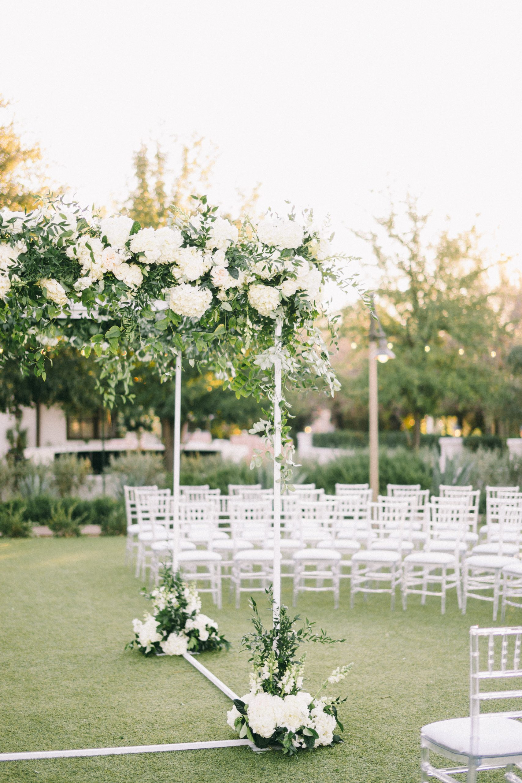 Sign with Umbrellas for Guests at Beach Elopement