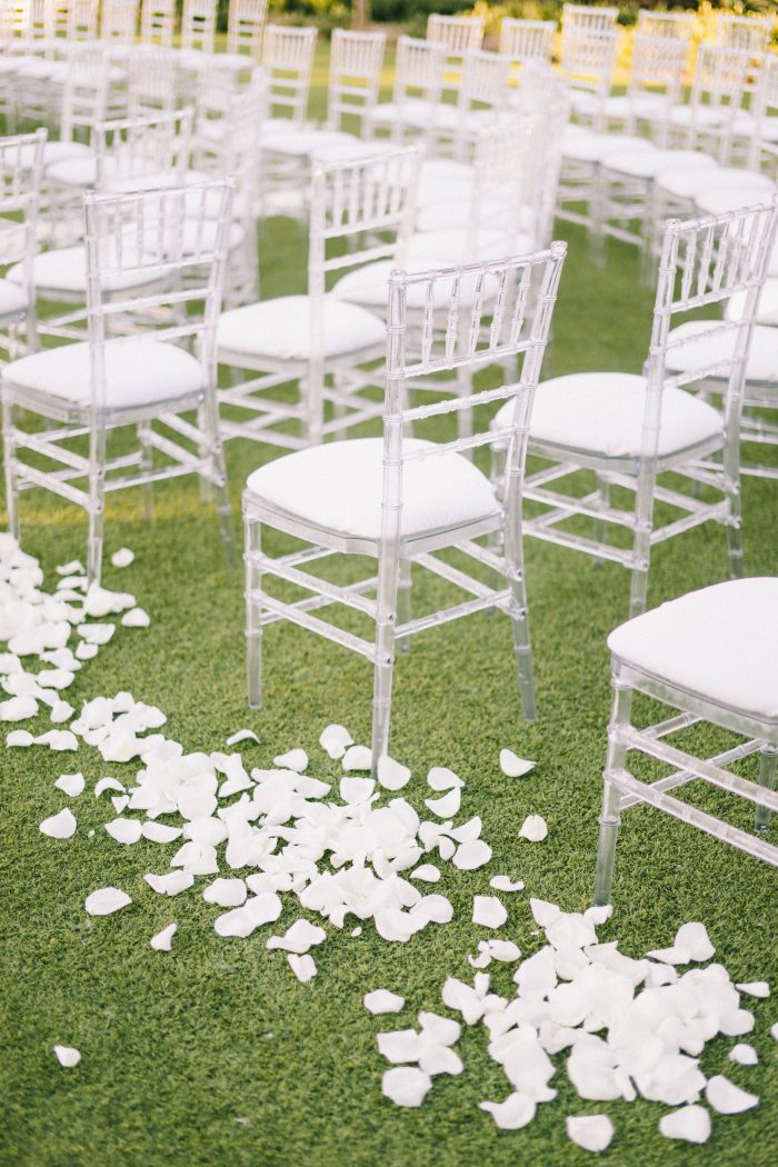 White Rose Petals on Aisle by Chairs at Midcentury Wedding