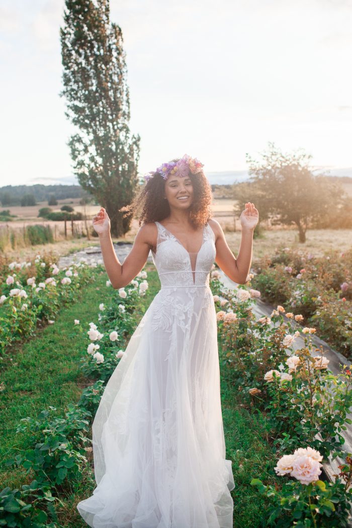 Black Bride Wearing Natural Textured Curly Wedding Hairstyle with Flower Crown and Rebecca Ingram Wedding Dress