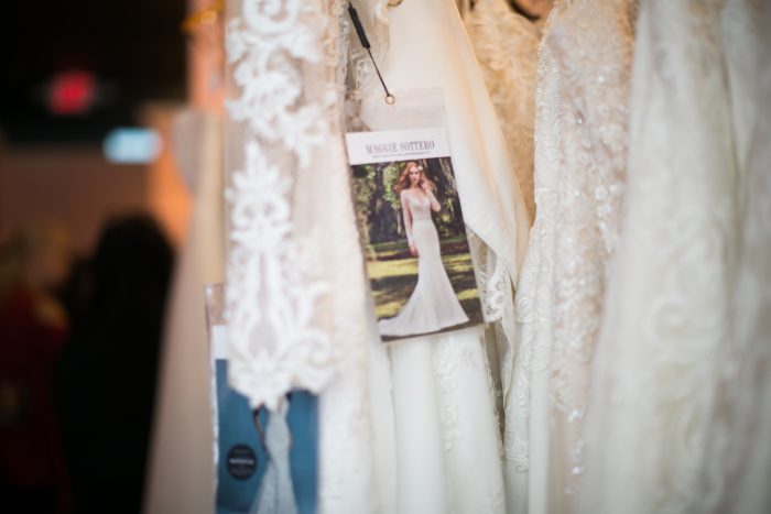 Wedding Dresses Hanging on Rack with Maggie Sottero tag