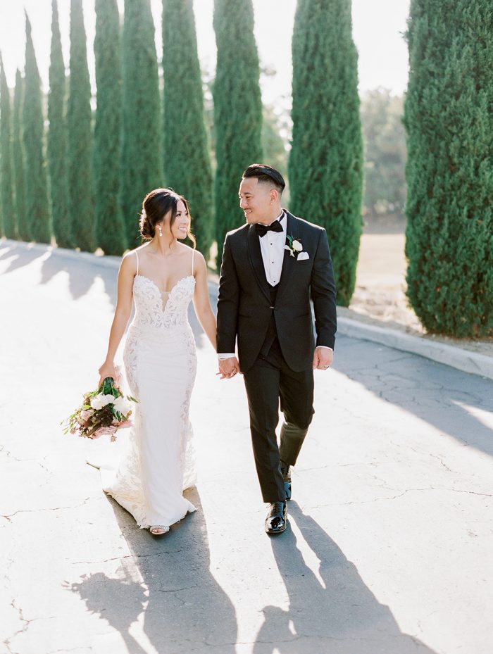 Groom with Real Bride Wearing Crepe Sheath Wedding Dress Called Darshana by Maggie Sottero
