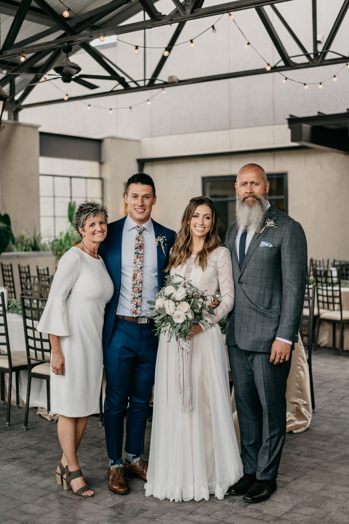 Bride and Groom Standing with Mother and Father of the Bride at Boho Wedding