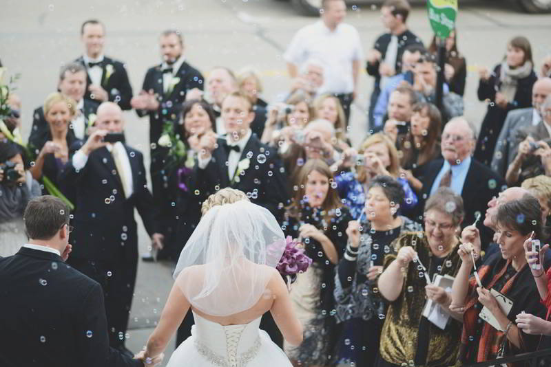 Bride and Groom Leaving Their Wedding Ceremony and Celebrating with Guests