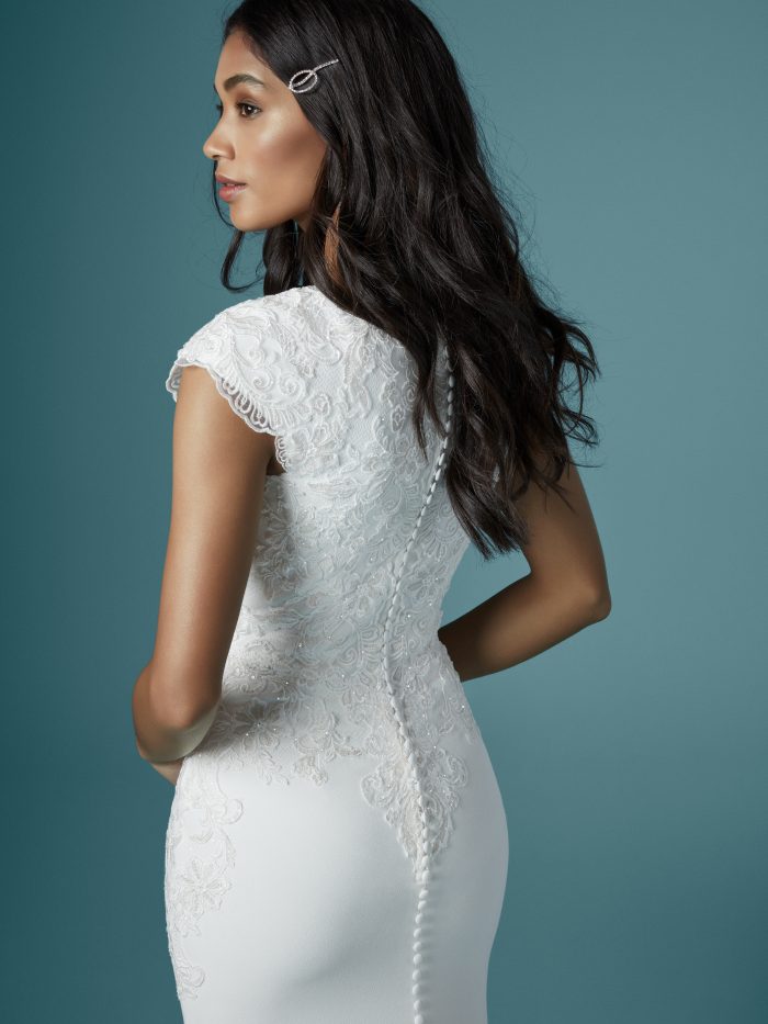 Model Wearing Short Sleeve Crepe Bridal Gown Called Cosette by Maggie Sottero