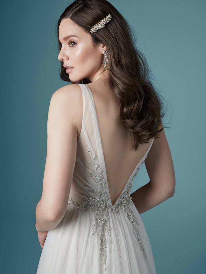 Model Wearing Romantic V-back Wedding Dress Called Meletta by Maggie Sottero