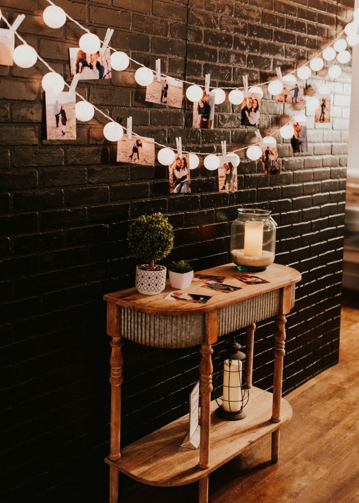 Hanging Pictures and Hanging Lights at Rustic Winter Wedding Venue