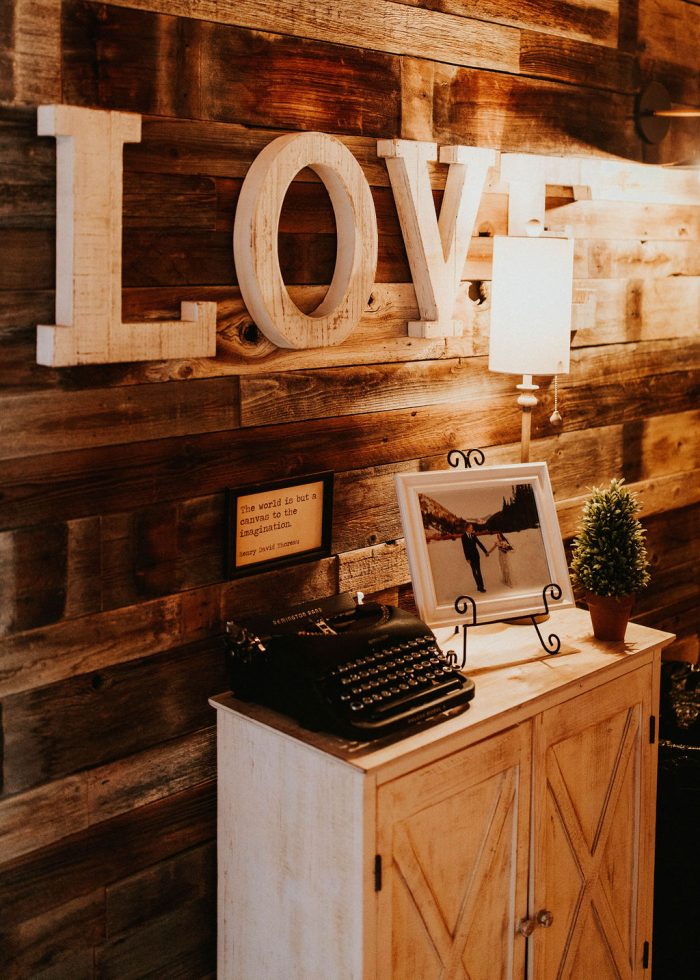 Rustic Chic Details at Wedding Featuring a Typewriter and a Love Sign