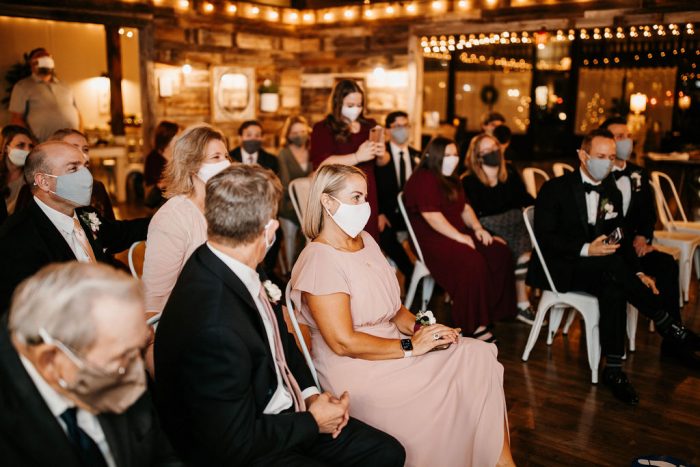 Guests Sitting at Rustic Wedding Ceremony During Covid and Wearing Masks