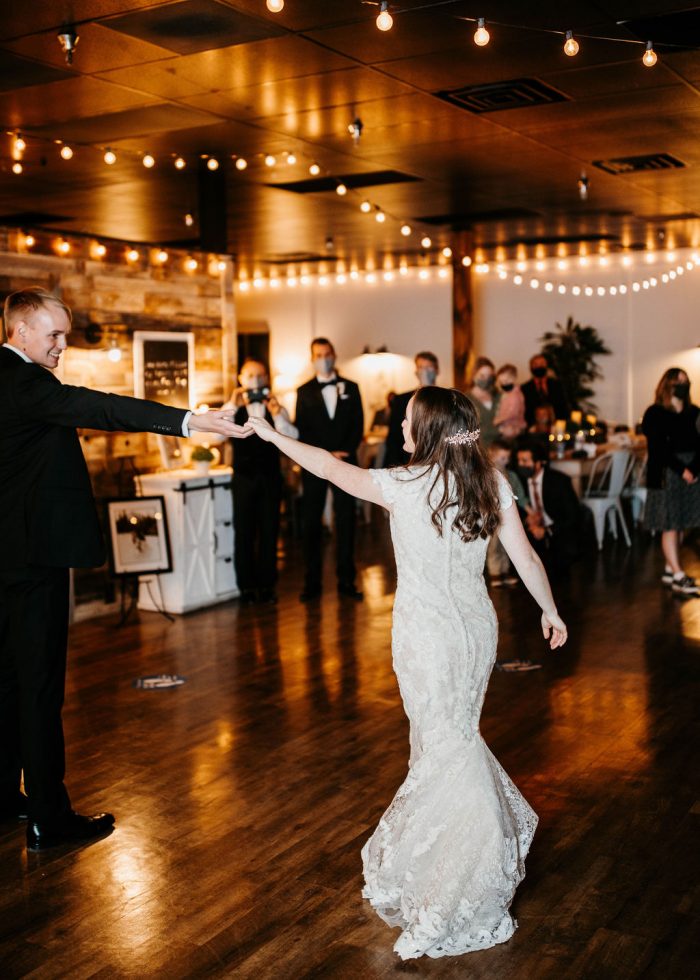 Bride and Groom Dancing during Choreographed First Dance at Rustic Chic Wedding