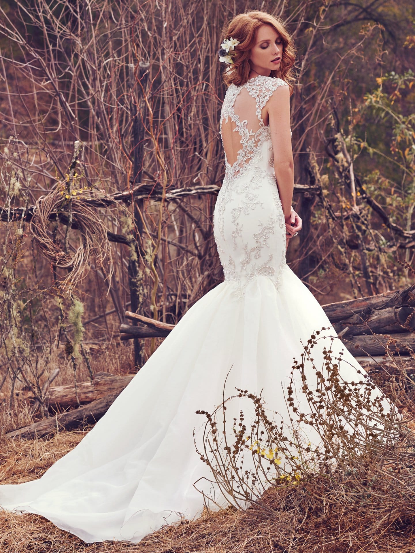 Beautiful statement-back wedding dresses from Maggie Sottero and Sottero and Midgley - Illusion cap-sleeves and an illusion keyhole back accented with lace appliqués complete the soft glamour of this wedding dress. Payson by Maggie Sottero.