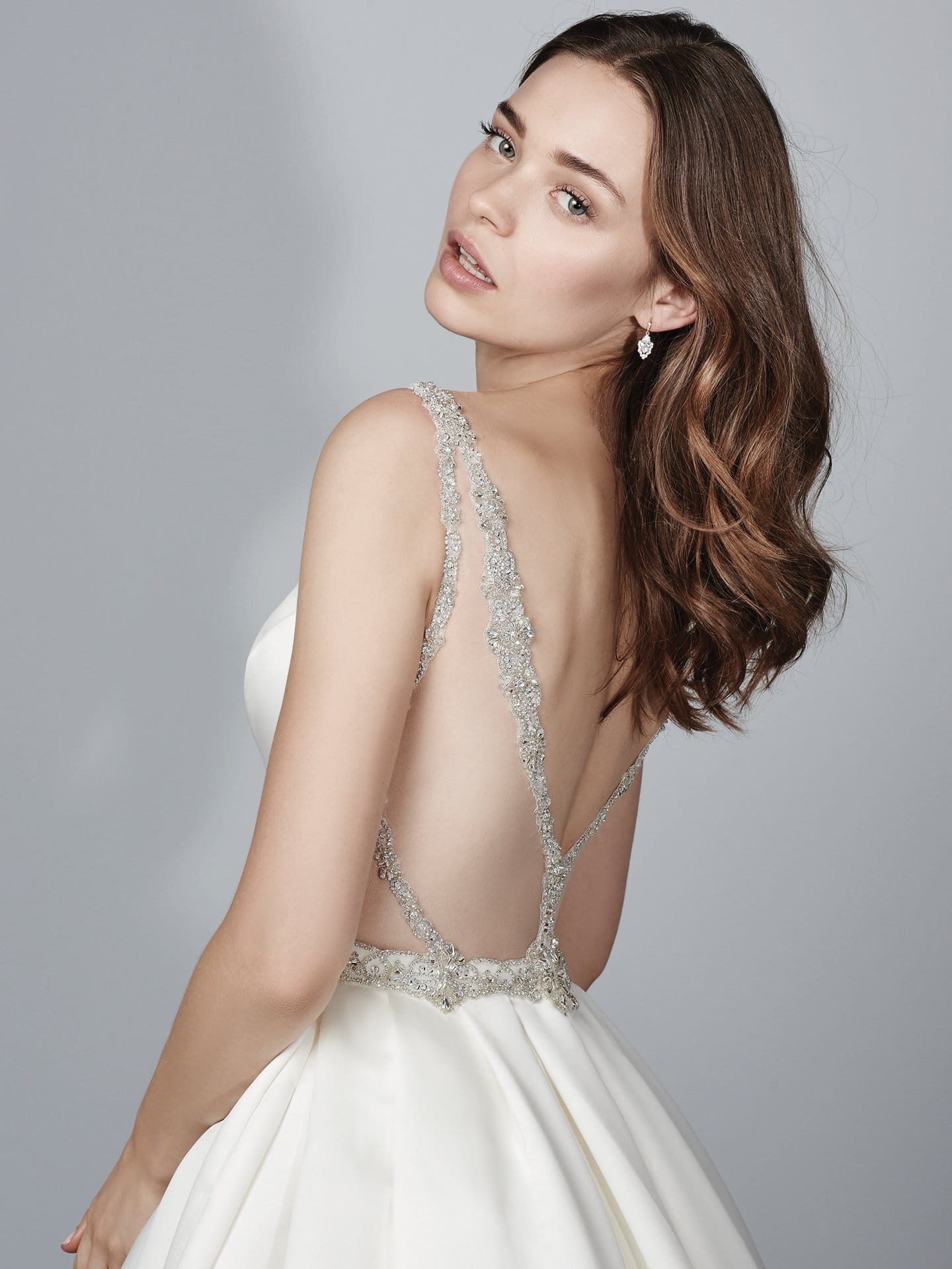 Beautiful statement-back wedding dresses from Maggie Sottero and Sottero and Midgley - Kiandra wedding dress with Jersey lining for a luxe, breezy and figure-flattering fit.