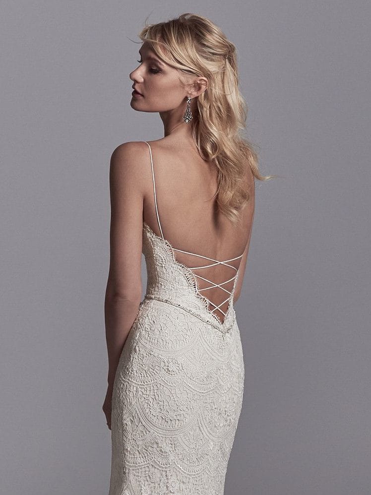 Beautiful statement-back wedding dresses from Maggie Sottero and Sottero and Midgley - Spaghetti straps glide from the V-neckline to crisscross strap details over the plunging back. Maxwell by Sottero and Midgley.
