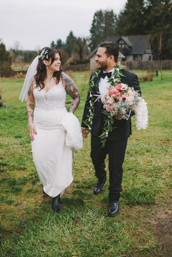 Real Bride Wearing Beaded Sheath Wedding Dress and Groom Walking and Smiling Together