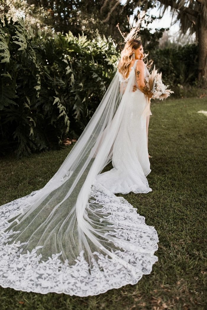 Bride Wearing Wedding Cape by Maggie Sottero