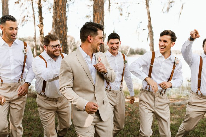 Groom and Groomsmen at Lakeside Wedding Wearing Casual Tan Suits 