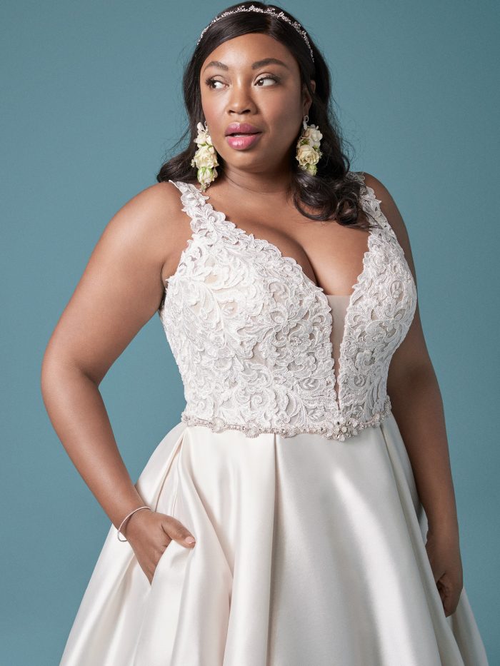 Curvy Model Wearing Plus Size Satin Princess Wedding Gown Called Sonnet by Maggie Sottero