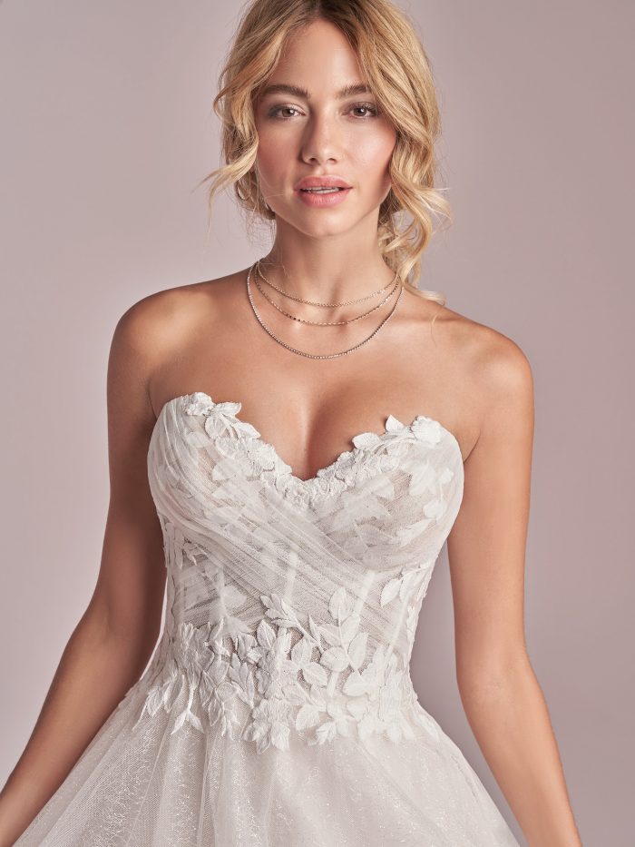 Model Wearing Strapless Princess Wedding Gown Called Remy by Rebecca Ingram