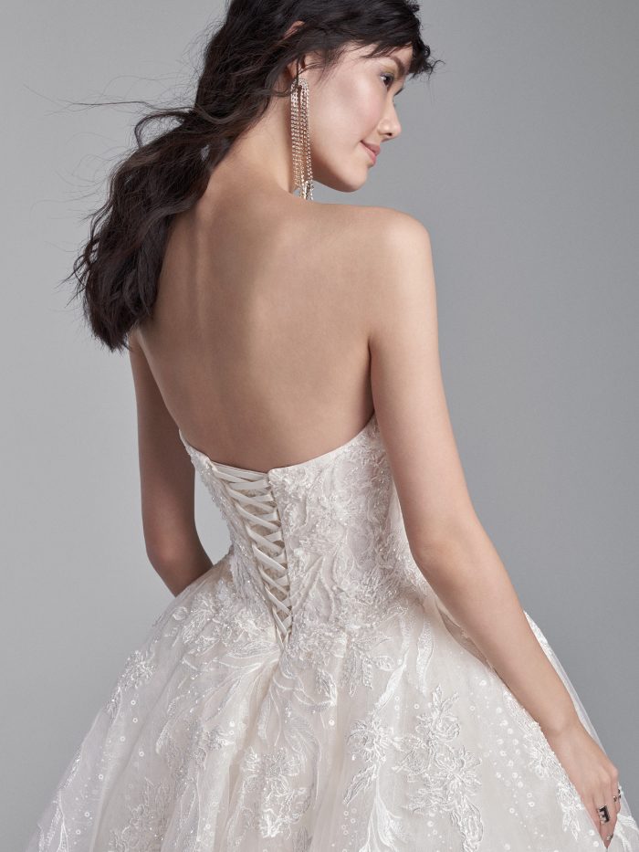 Model Wearing Strapless Ball Gown Wedding Dress with Corset Called Troy by Sottero and Midgley