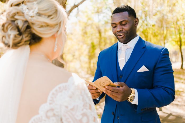 Groom Reading Vows to Real Bride Wearing Lace Ball Gown Wedding Dress Called Mallory Dawn by Maggie Sottero