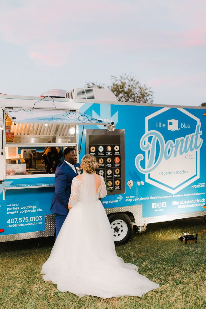 Real Bride and Groom Standing in Front of Homemade Donut Truck