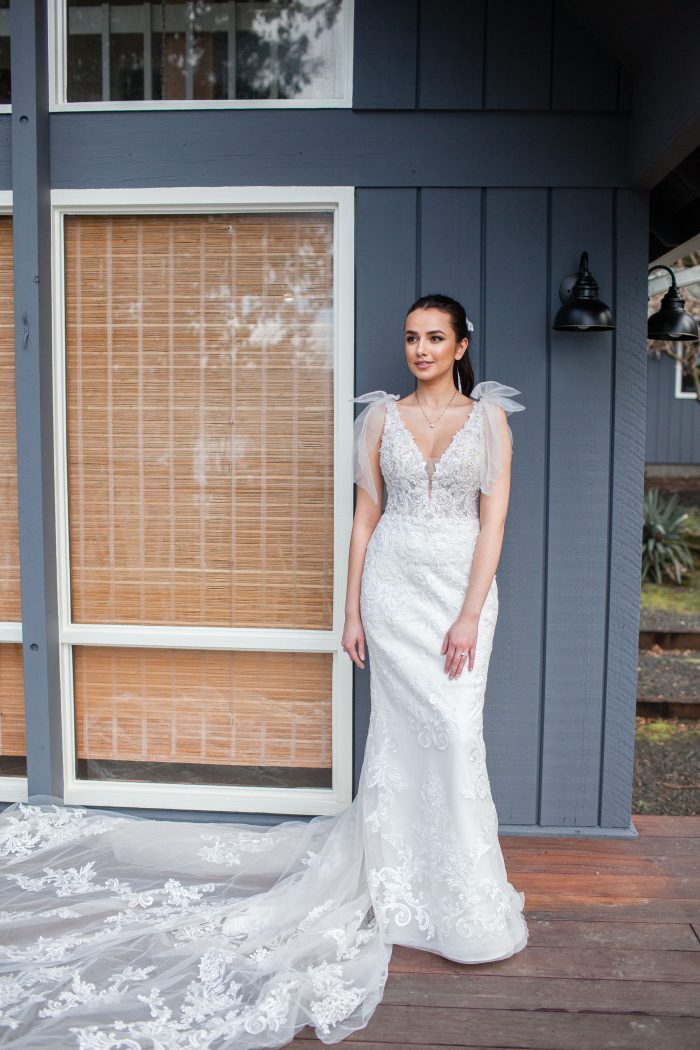 Bride at Beach House Wearing Fit-and-Flare Wedding Dress Called Easton by Sottero and Midgley