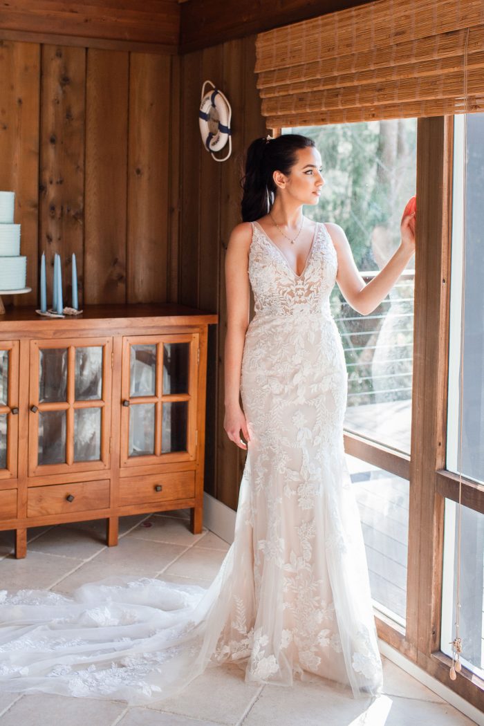 Bride in Beach House Wearing Floral Sheath Wedding Dress Called Greenley by Maggie Sottero