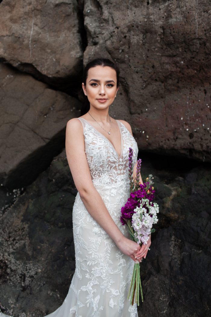 Bride on Rocky Beach Wearing Floral Beach Wedding Dress Called Greenley by Maggie Sottero