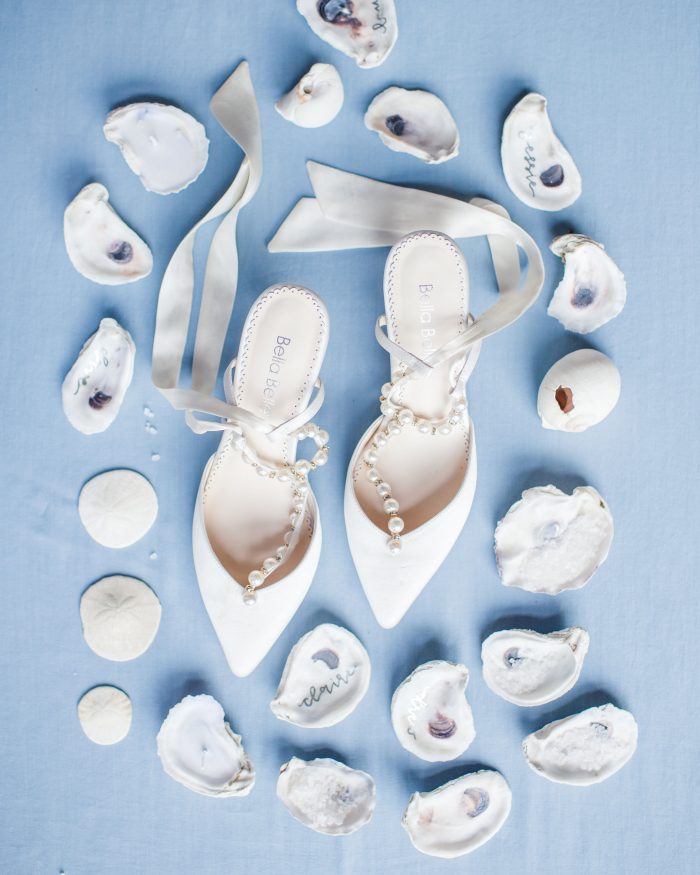White Closed Toe Shoes with Pearls on Straps Surrounded by Seashells