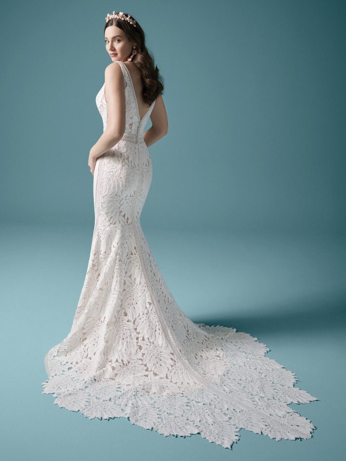 Model Wearing Nature-inspired Lace Sheath Wedding Dress Called Burke Made by Maggie Sottero