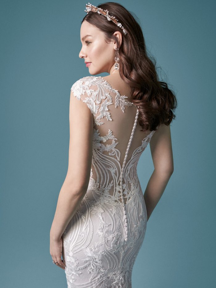 Model Wearing Cap-sleeve Boho Wedding Dress Called Keenan by Maggie Sottero
