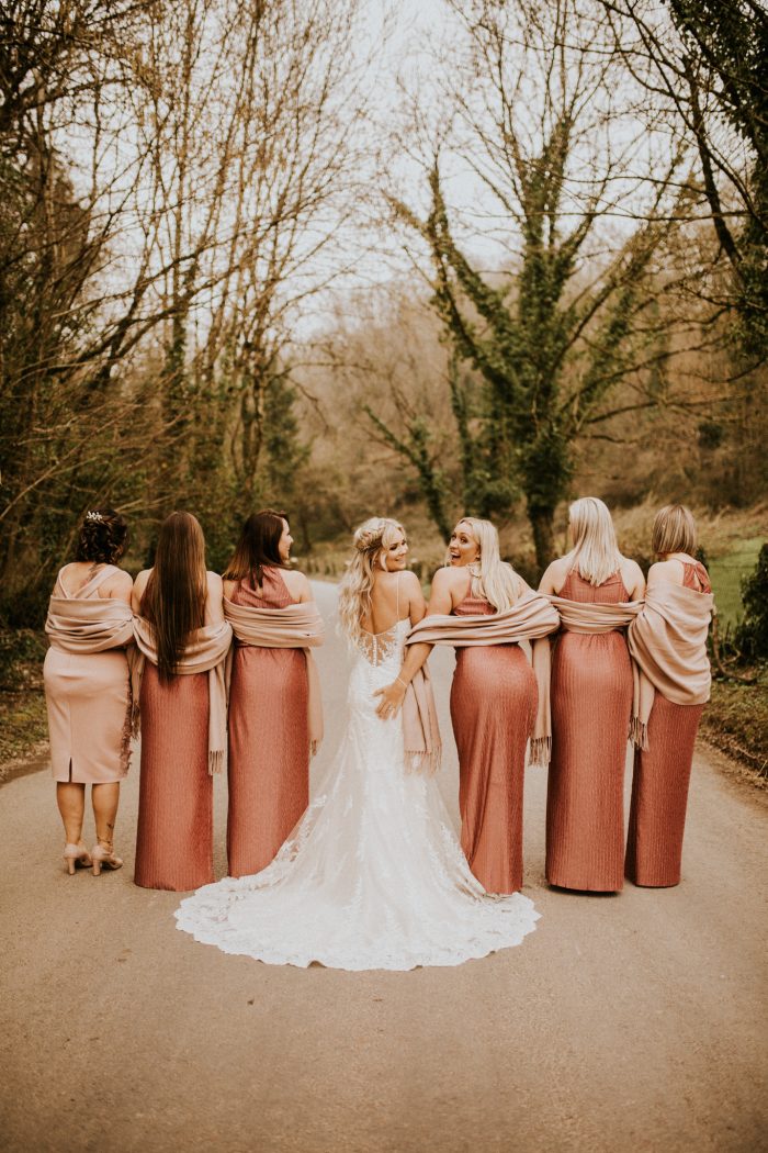 Bride Wearing Beachy Curls with Half Updo with Bridesmaids