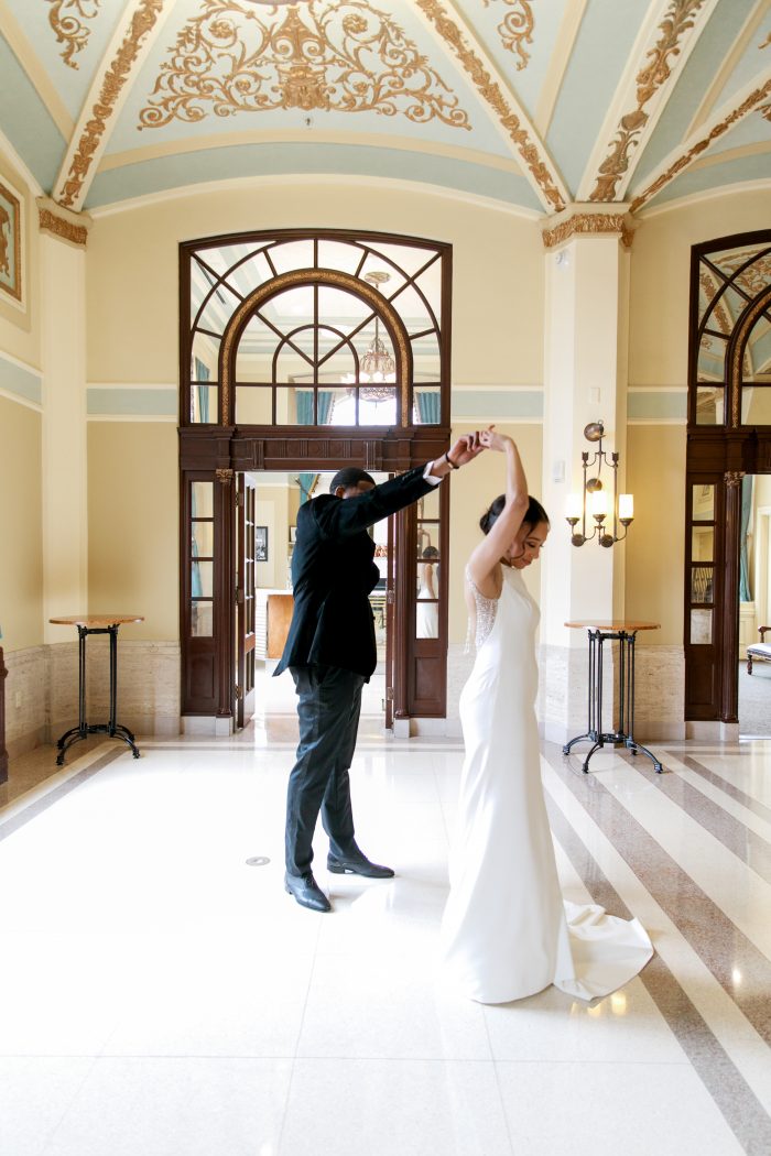 Groom with Real Bride Spinning in Chic and Classic Wedding Dress Evangelina by Maggie Sottero