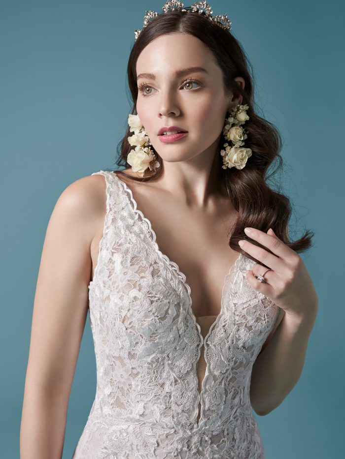 Model Wearing Square Back Lace Sheath Wedding Dress with Overskirt Called Callan by Maggie Sottero