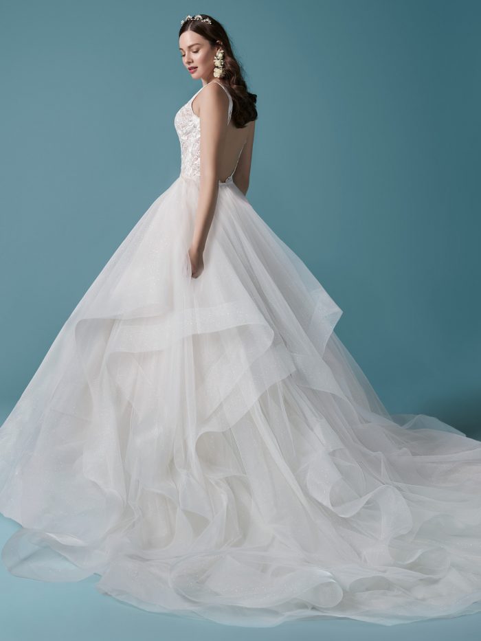 Model Wearing Square Back Lace Sheath Wedding Dress with Overskirt Called Callan by Maggie Sottero
