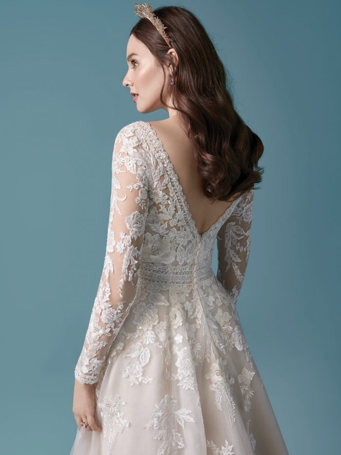 Model Wearing Romantic Illusion Sleeve A-line Wedding Dress Called Raphael by Maggie Sottero