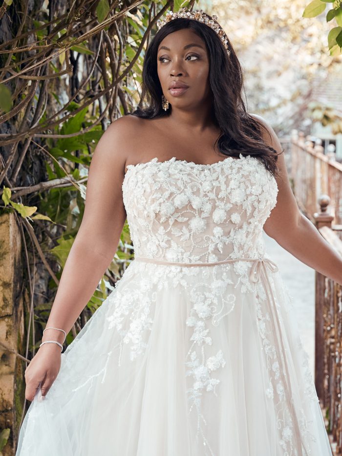Plus Size Model Wearing Floral Lace Plus Size A-line Wedding Dress Called Zareen Lynette by Maggie Sottero