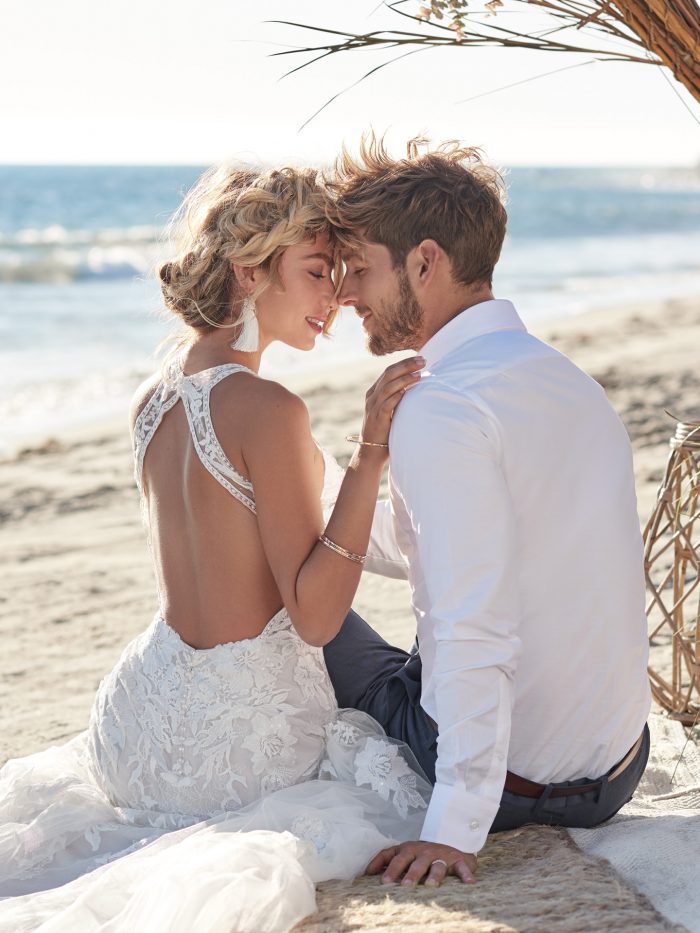 Groom with Bride on Beach Wearing Dramatic Back Wedding Dress Called Elizabetta by Rebecca Ingram