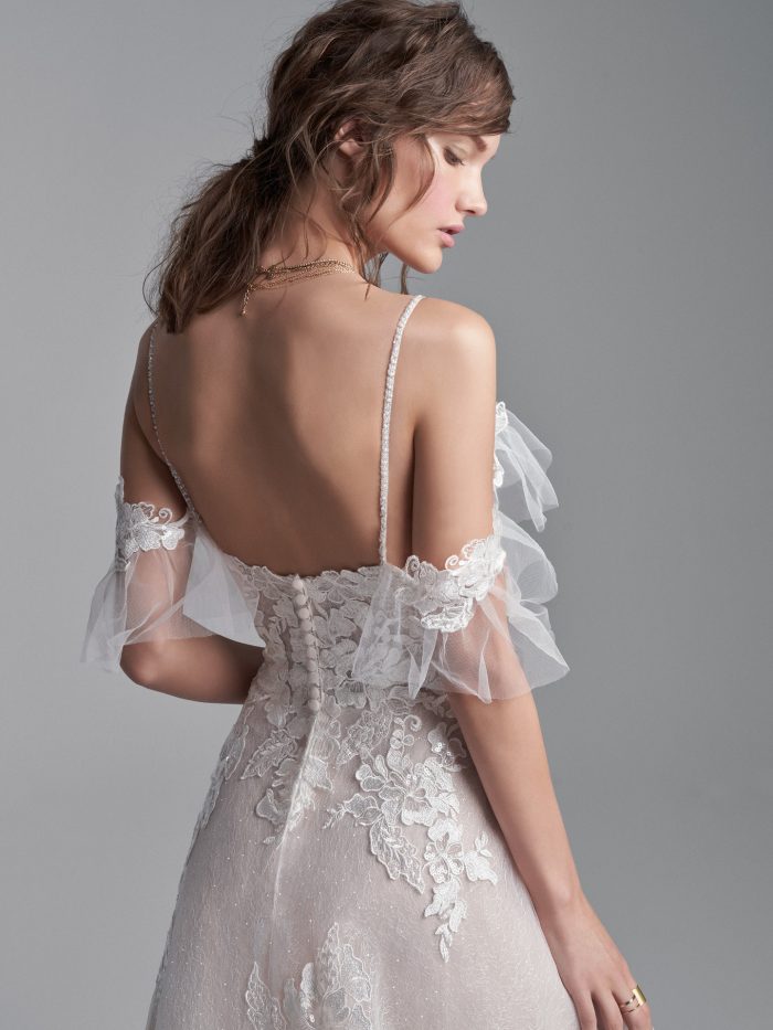 Model Wearing Cold Shoulder Floral Lace A-line Wedding Gown Called Houston by Sottero and Midgley