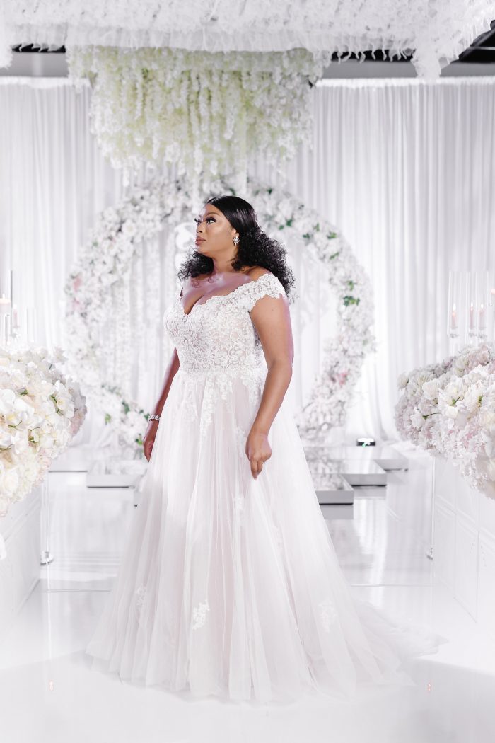 Curvy Black Model Wearing Plus Size Princess Wedding Dress Called Natalie by Maggie Sottero