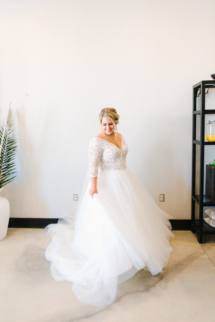 Curvy Bride Spinning in Princess Bridal Gown Called Mallory Dawn by Maggie Sottero