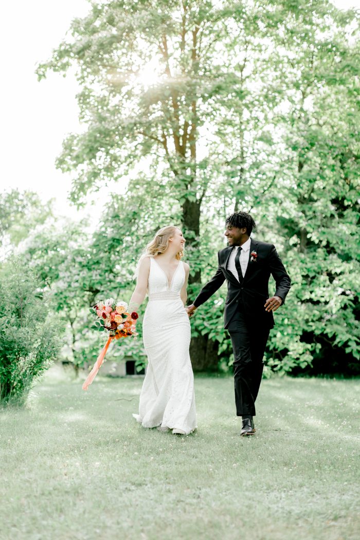 Groom Walking with Bride Wearing Boho V-neck Wedding Dress Called Burke by Maggie Sottero