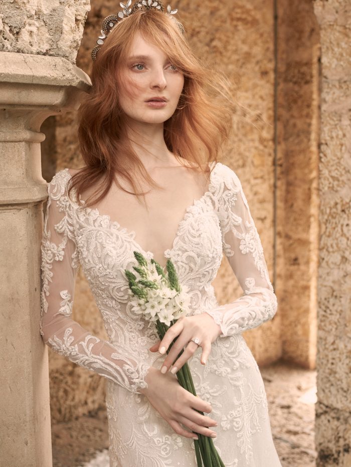 Bride Holding Bouquet and Wearing Illusion Lace Sleeve Wedding Gown Called Johanna by Maggie Sottero
