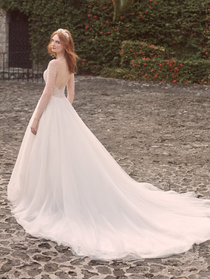 Model Wearing Long Sleeve Pearl Ball Gown Wedding Dress Called Rosette by Maggie Sottero