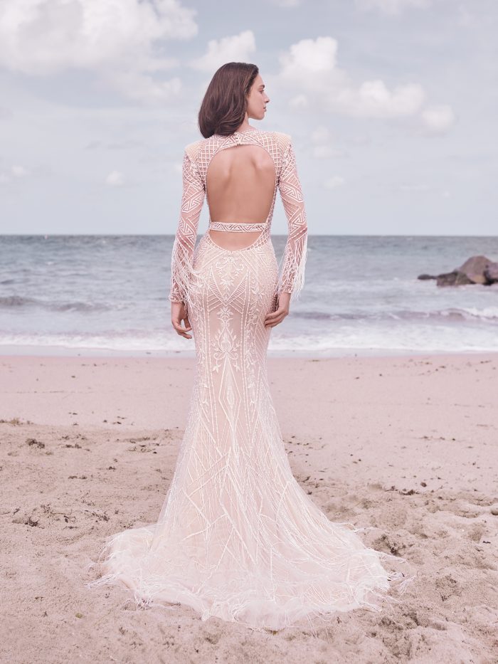 Bride on Beach Wearing Art Deco Wedding Dress with Fringe Called Andrew by Sottero and Midgley