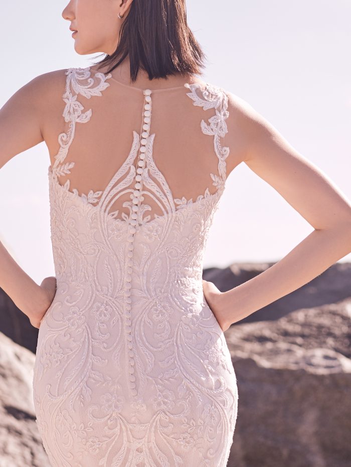 Model Wearing Elegant Lace Wedding Dress with Higher Back for Added Support by Sottero and Midgley