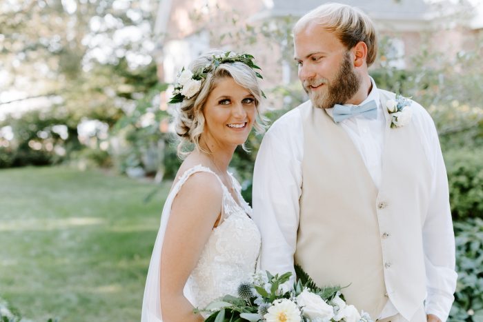 Groom with Bride Wearing Chignon with a Boho Flower Crown at Outdoor Wedding