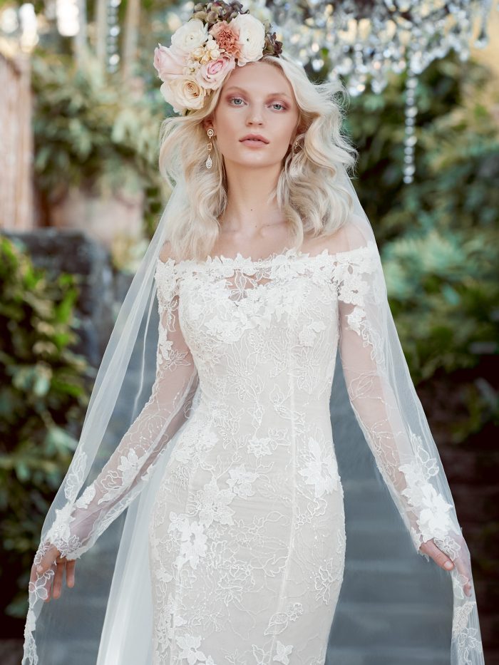 Model Wearing Off-the-Shoulder Sleeve Wedding Dress with Cathedral Wedding Veil Called Emiliano by Maggie Sottero