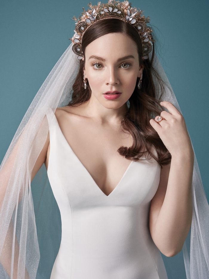 Model Wearing Minimalist Crepe Wedding Gown with Simple Tulle Veil Called Fernanda by Maggie Sottero